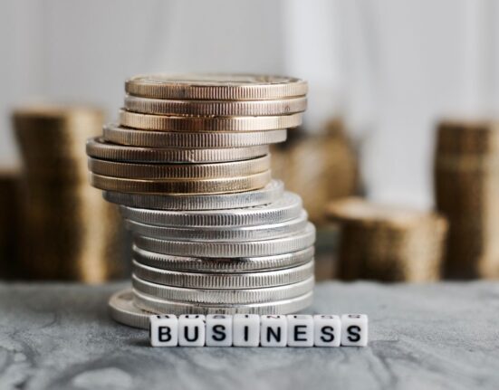 Business money illustrated using coins and the word "business"