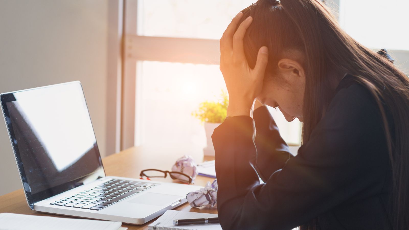 Businesswoman feeling downcast over business failure