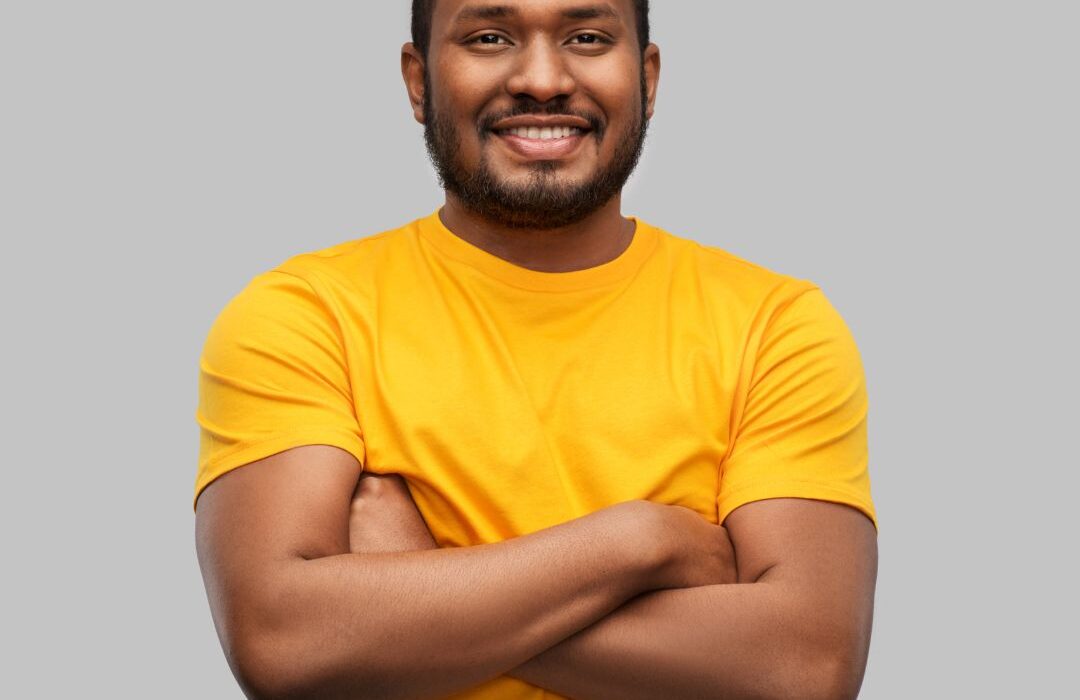 Smiling guy in yellow shirt