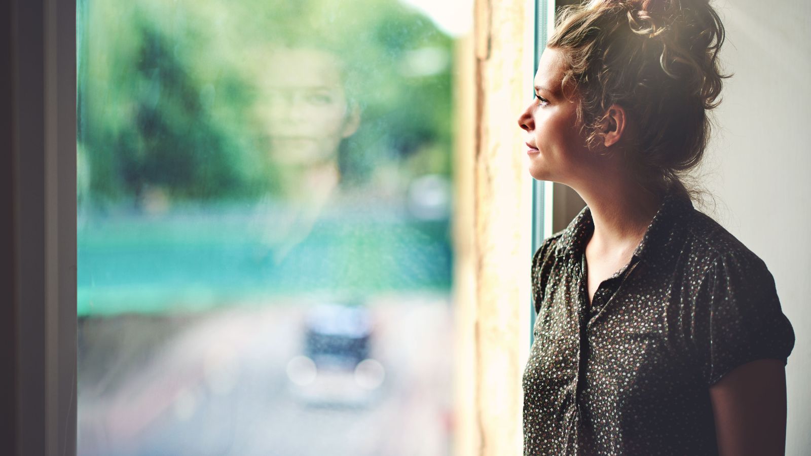 A woman staring out the window