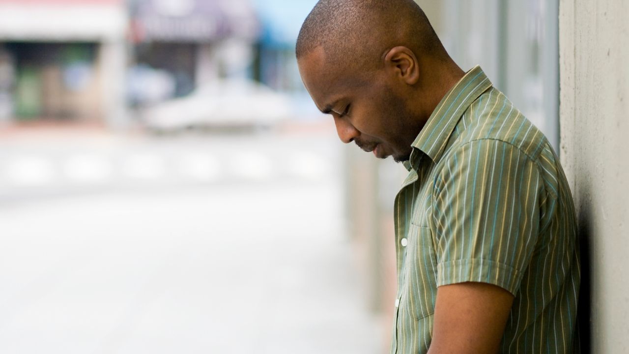 man with head down