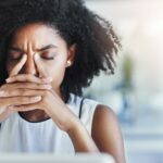 black woman at desk - how to get rid of distractions