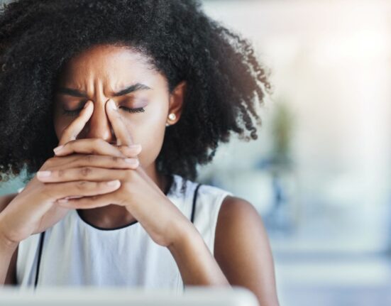 black woman at desk - how to get rid of distractions