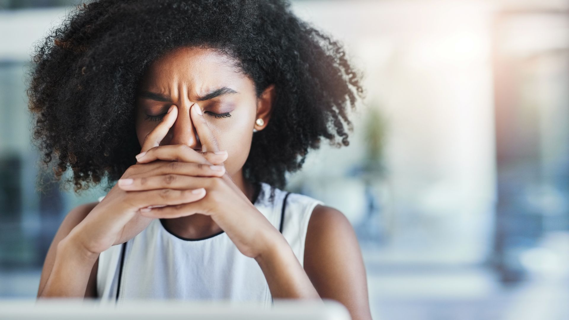 black woman at desk - how to get rid of distractions