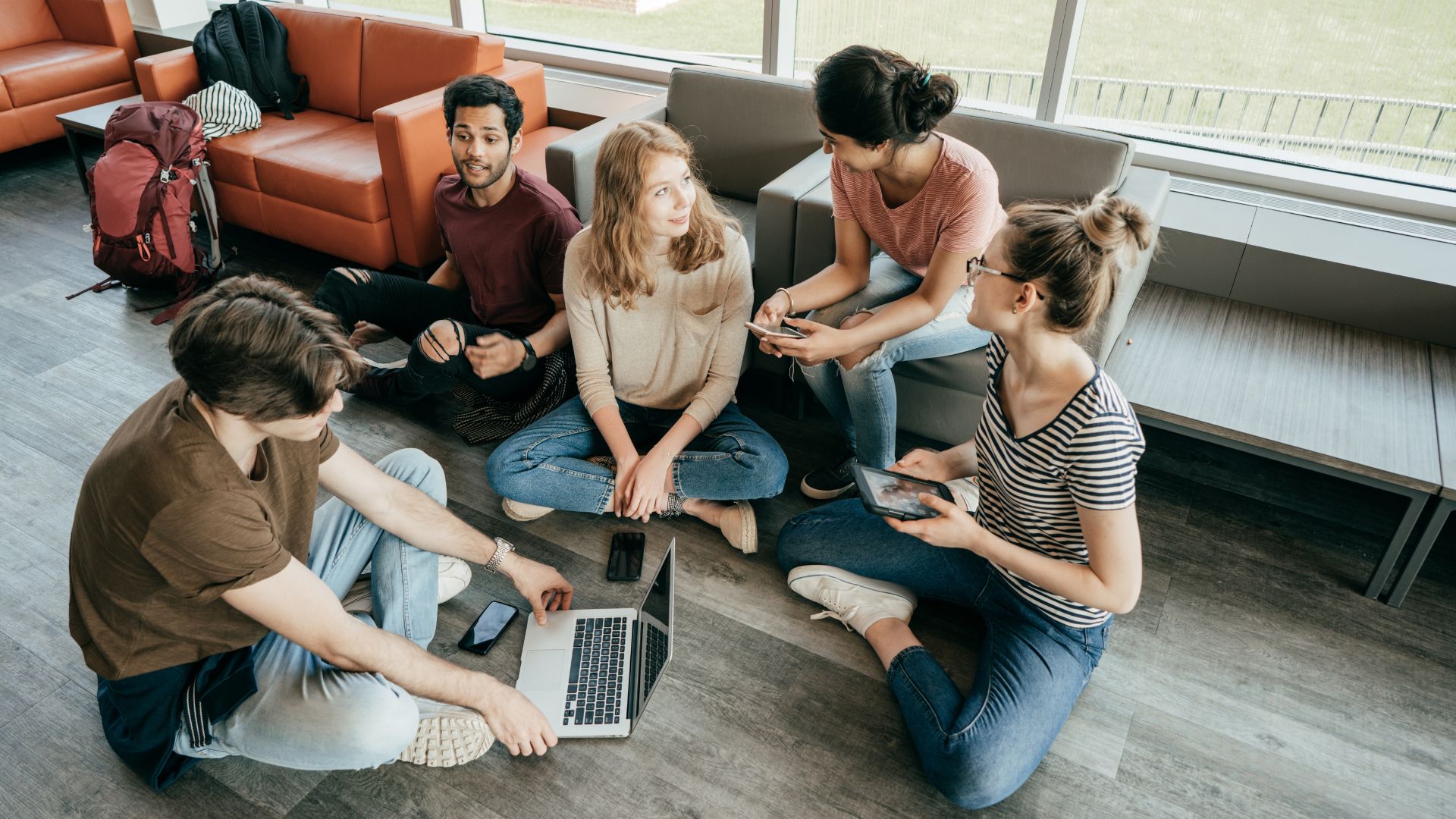 people sitting on the floor talking