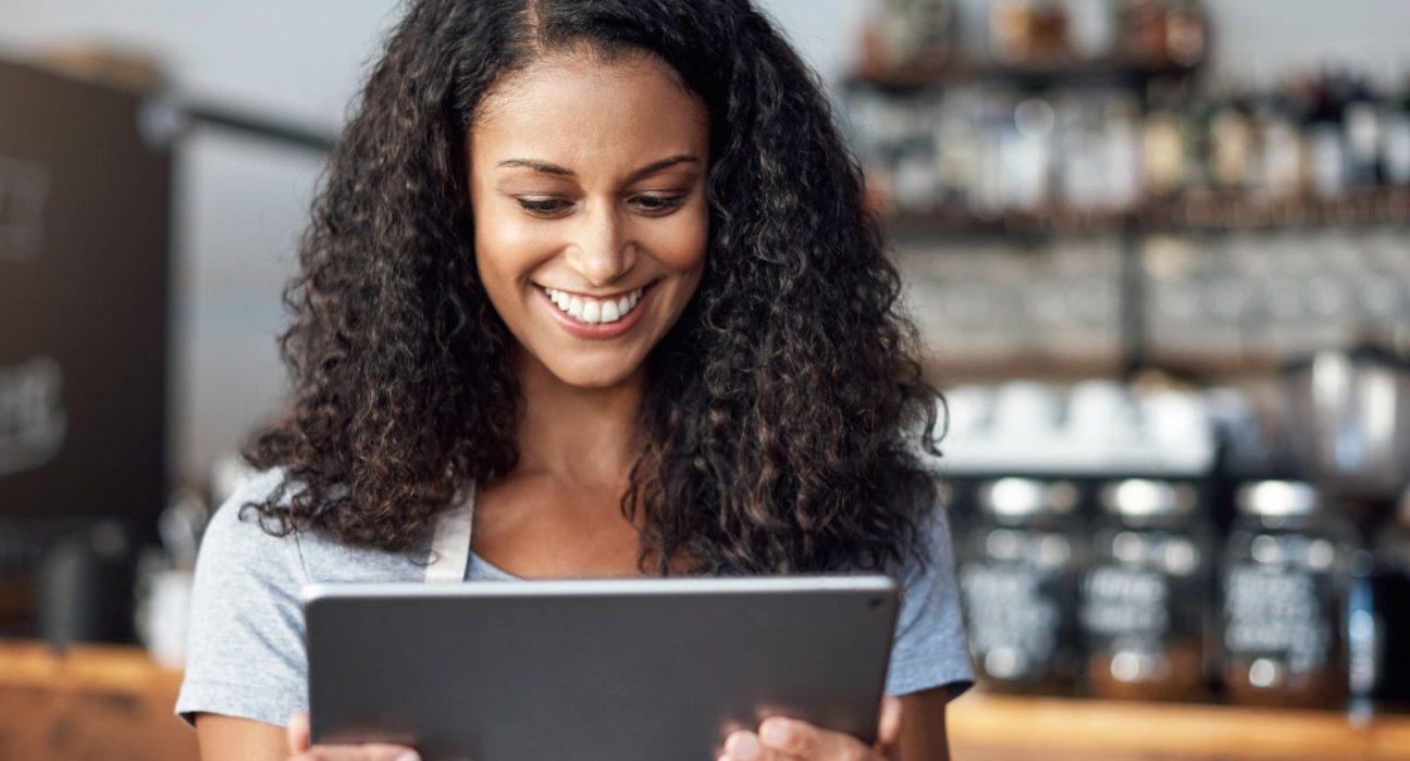 business tools - woman smiling at computer